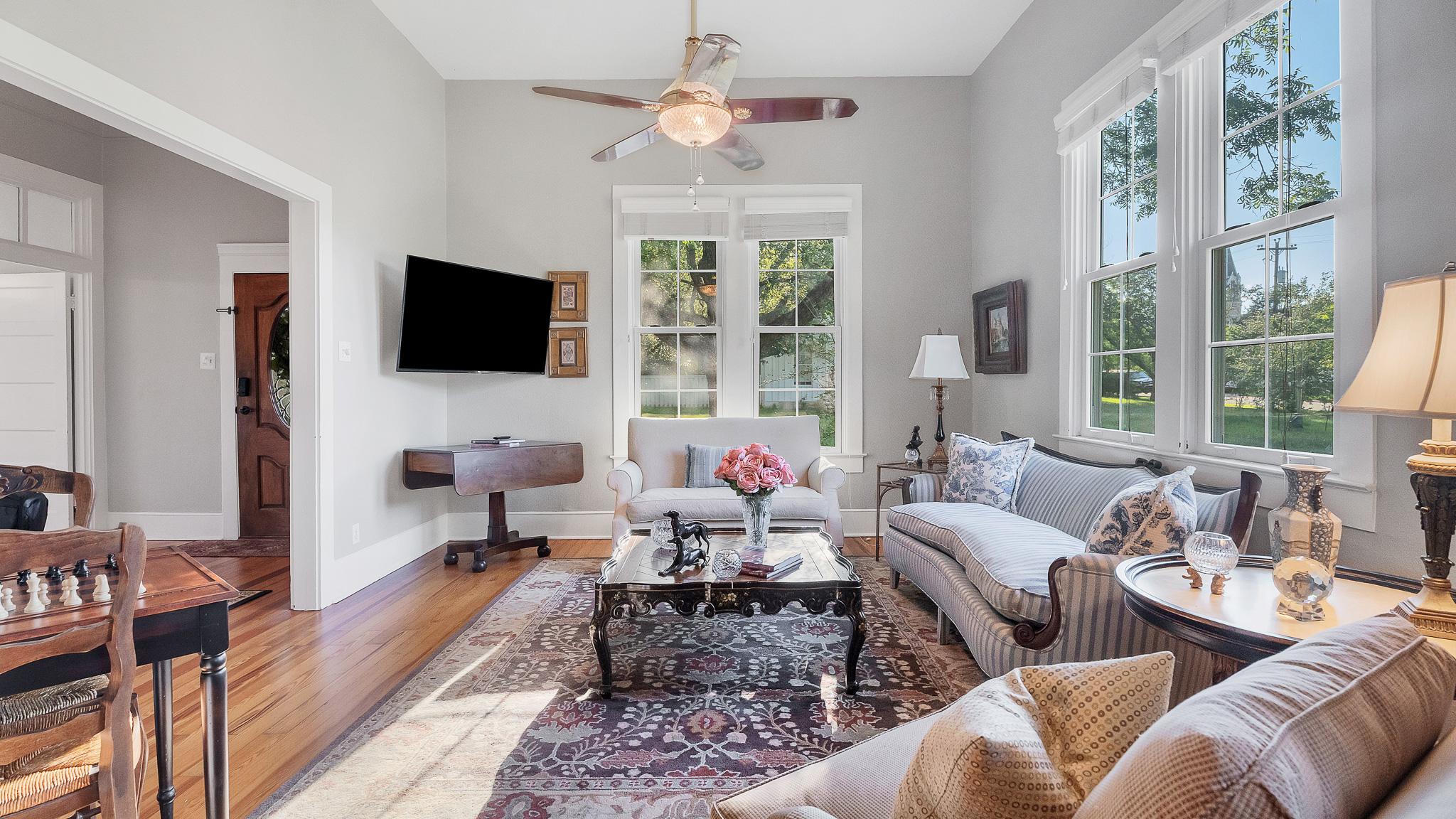Living room photo with tall windows and natural light at 1305 S College St
