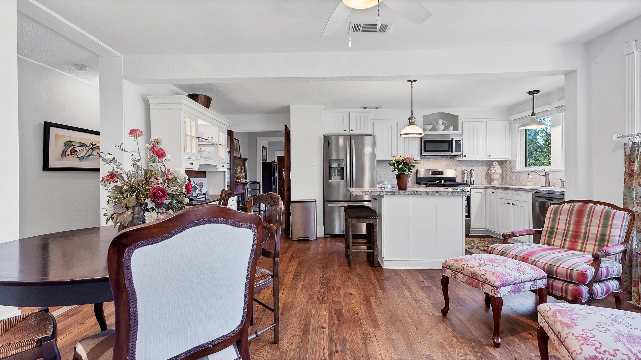 Open dining and kitchen view at 1305 S College St Georgetown Texas
