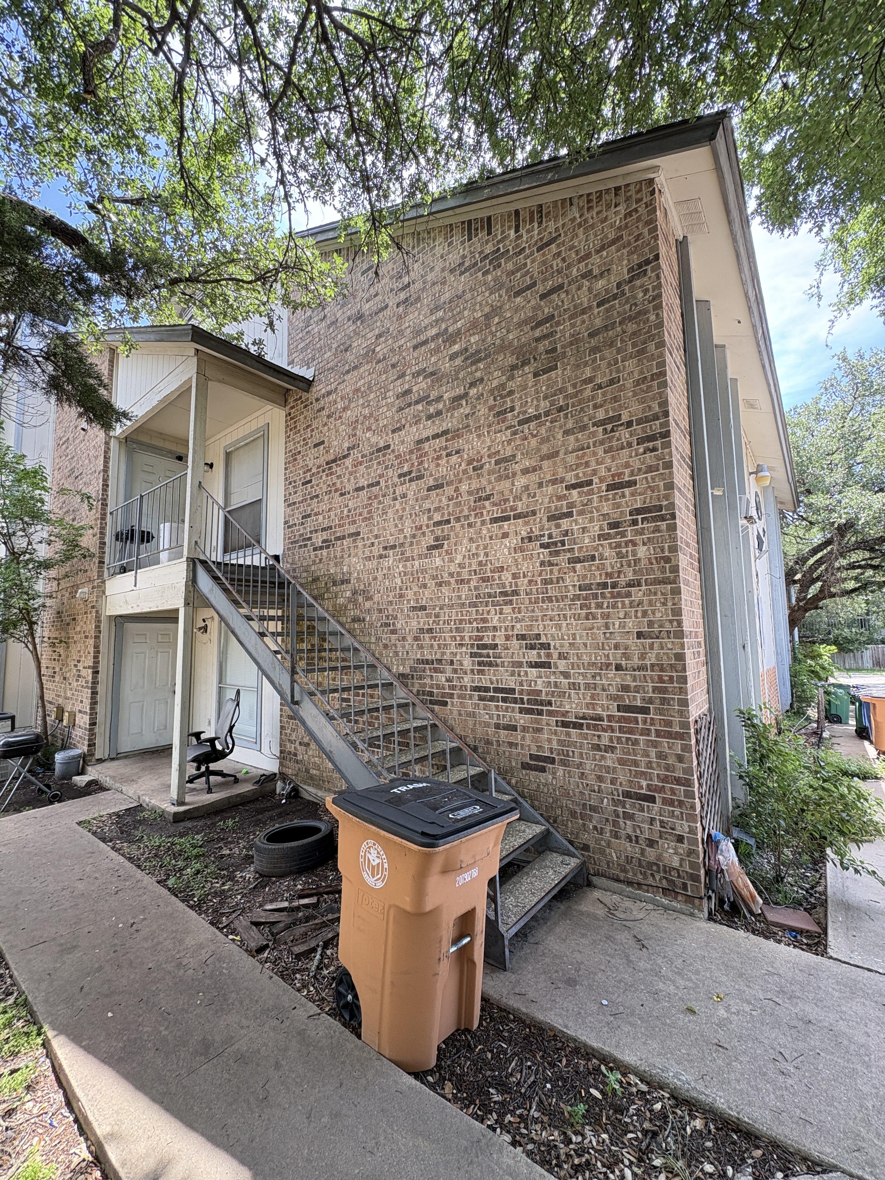 Side exterior stairway view at 4312 Acropolis Ct in Austin Texas